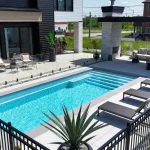 Mova fiberglass inground pool, model 12x28, Diamond finish in Loup Gris, installed by PurPiscine