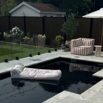 Mova fiberglass inground pool, model 12x22, Diamond finish in Noir Profond, installed by Concept Piscine Design