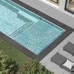 Piscine creusée en fibre de verre Mova, modèle 12x25 - Avec terrasse, finition Diamant couleur Mova