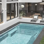 Piscine creusée en fibre de verre Mova, modèle 12x25 - Avec terrasse, finition Diamant couleur Mova